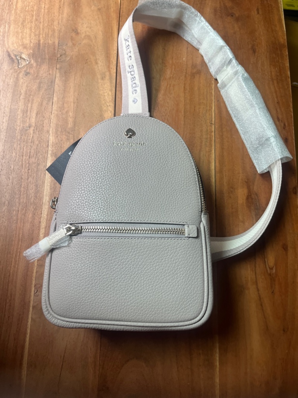kate spade Pebbled Leather Mini Sling Backpack Bag in Light Gray